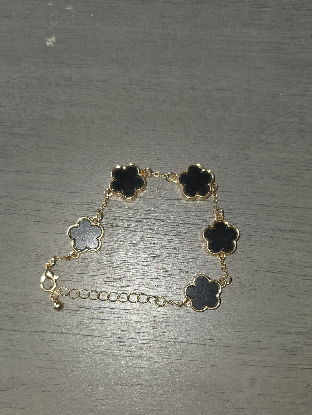 35 - T.J.Maxx Gold-Tone Bracelet with Black Clover Accents